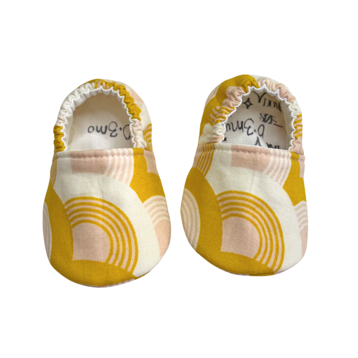 Golden Rainbow baby moccasins original front view, size 0–3 months