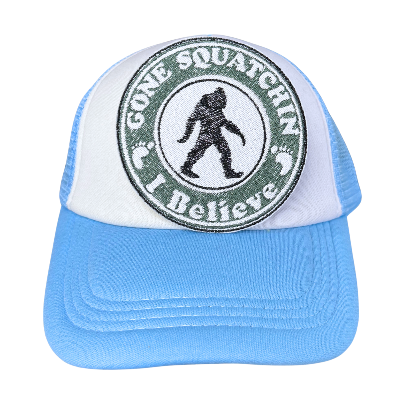 "Gone Squatchin' – I Believe" embroidered patch attached to a light blue and white trucker hat.