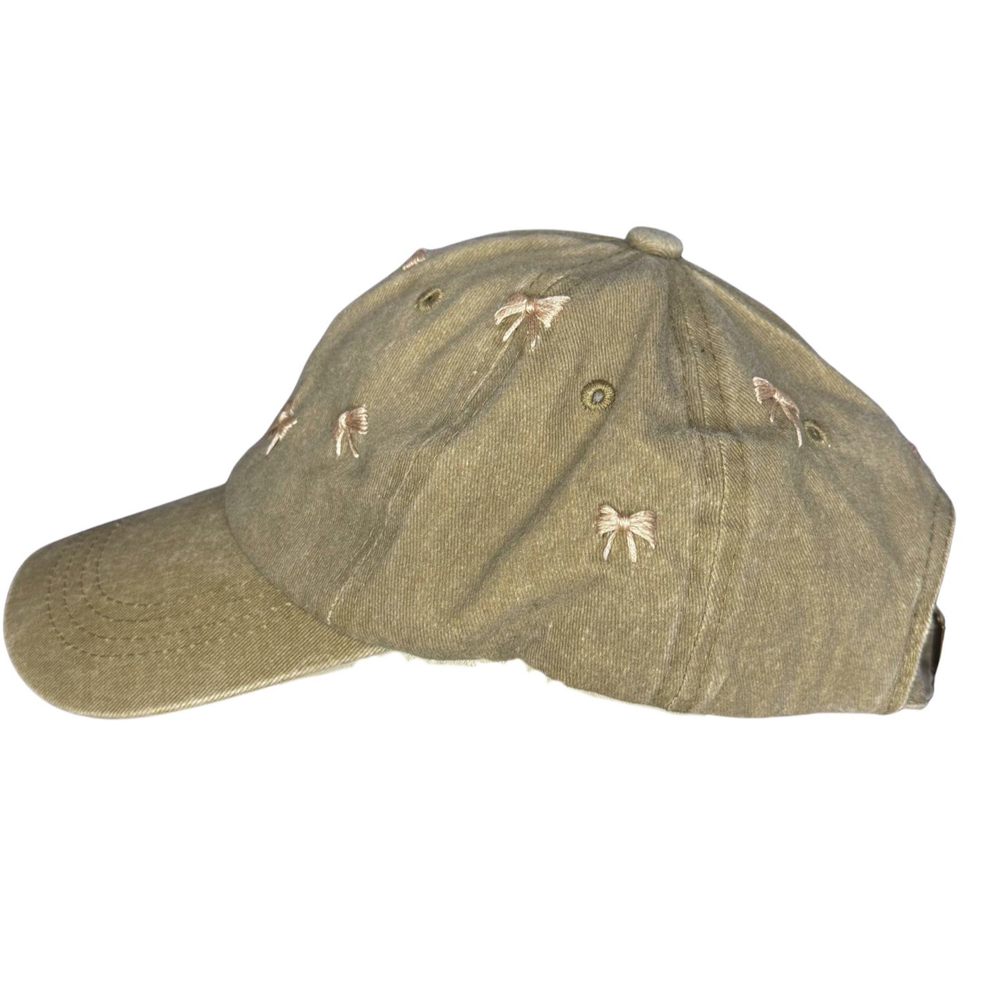 Green baseball cap with embroidered designs on a white background