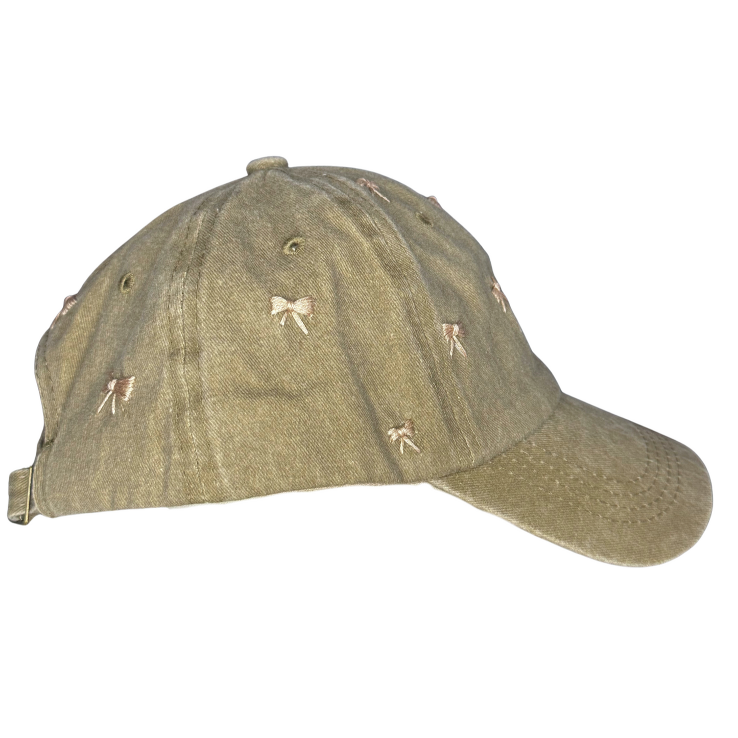 Green cap with embroidered designs on a white background