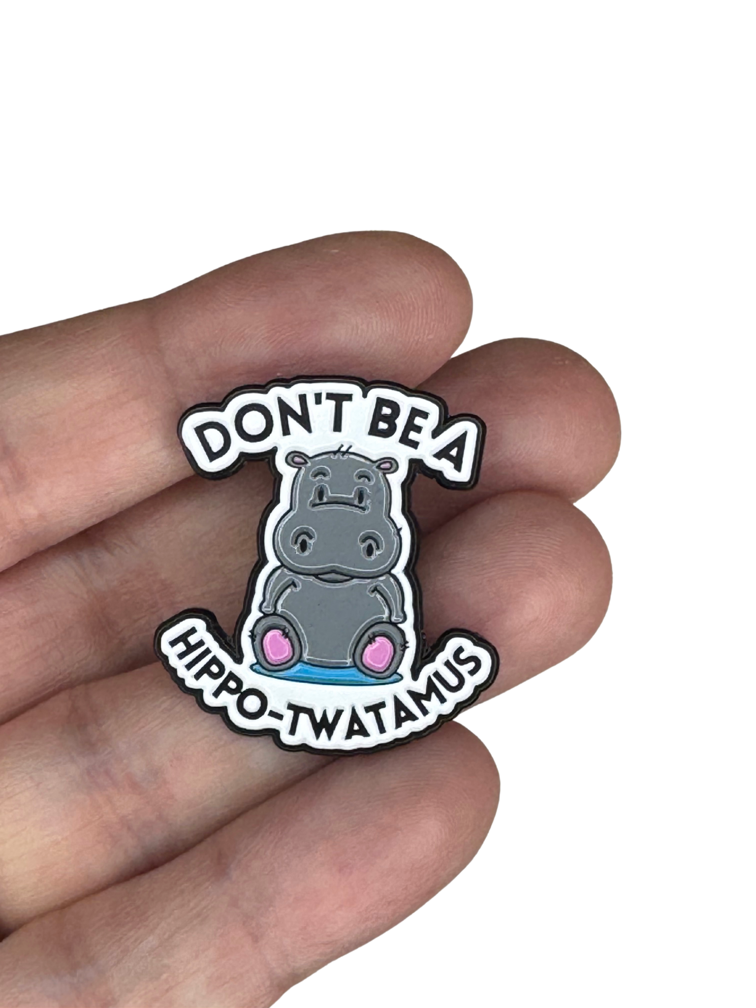 Pin shown between fingers to display size