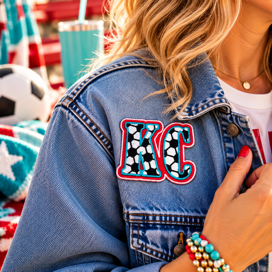 KC Current soccer iron-on patch styled on denim jacket