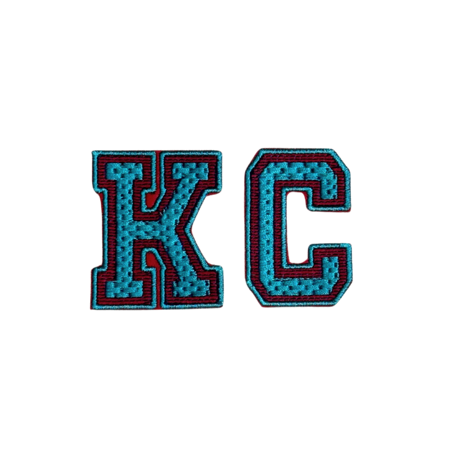 KC varsity-style chenille patch in teal with red and black outline
