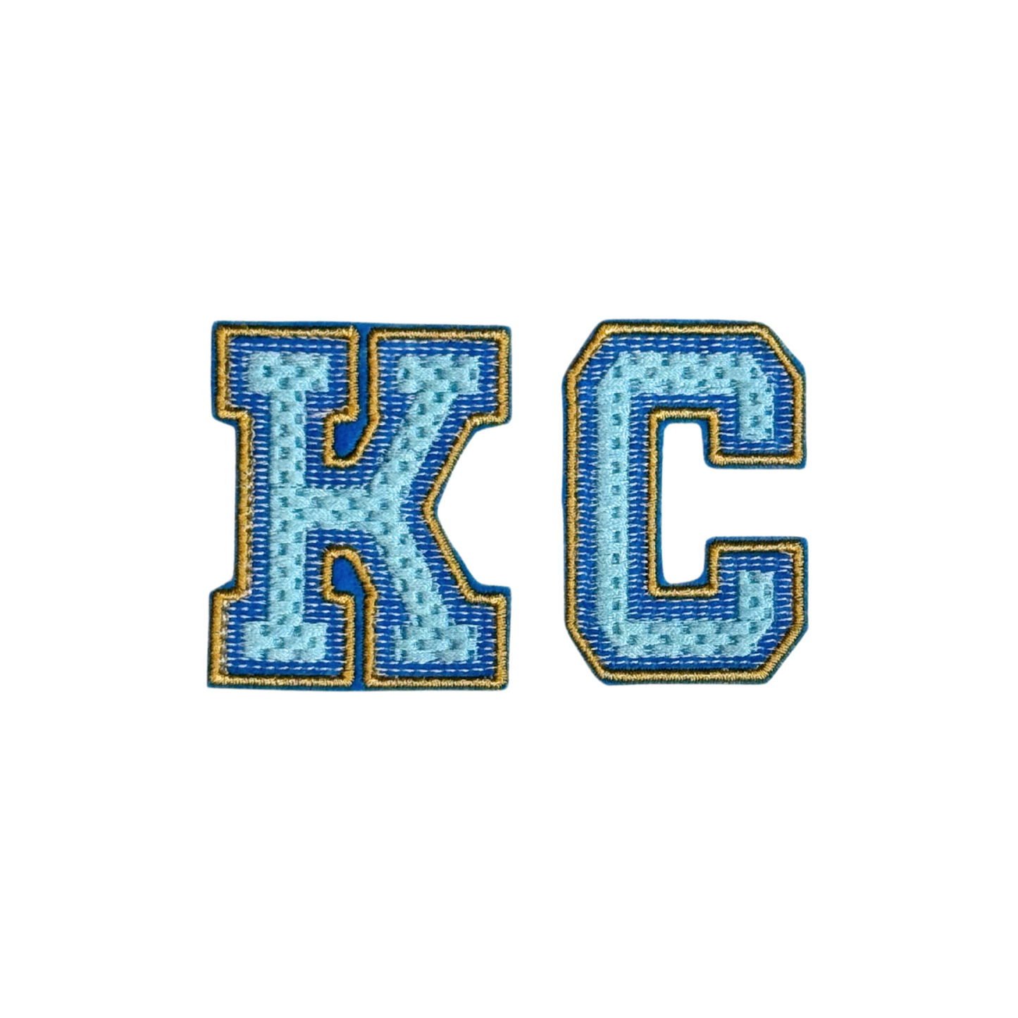 KC varsity chenille patch in light blue with royal blue and gold border