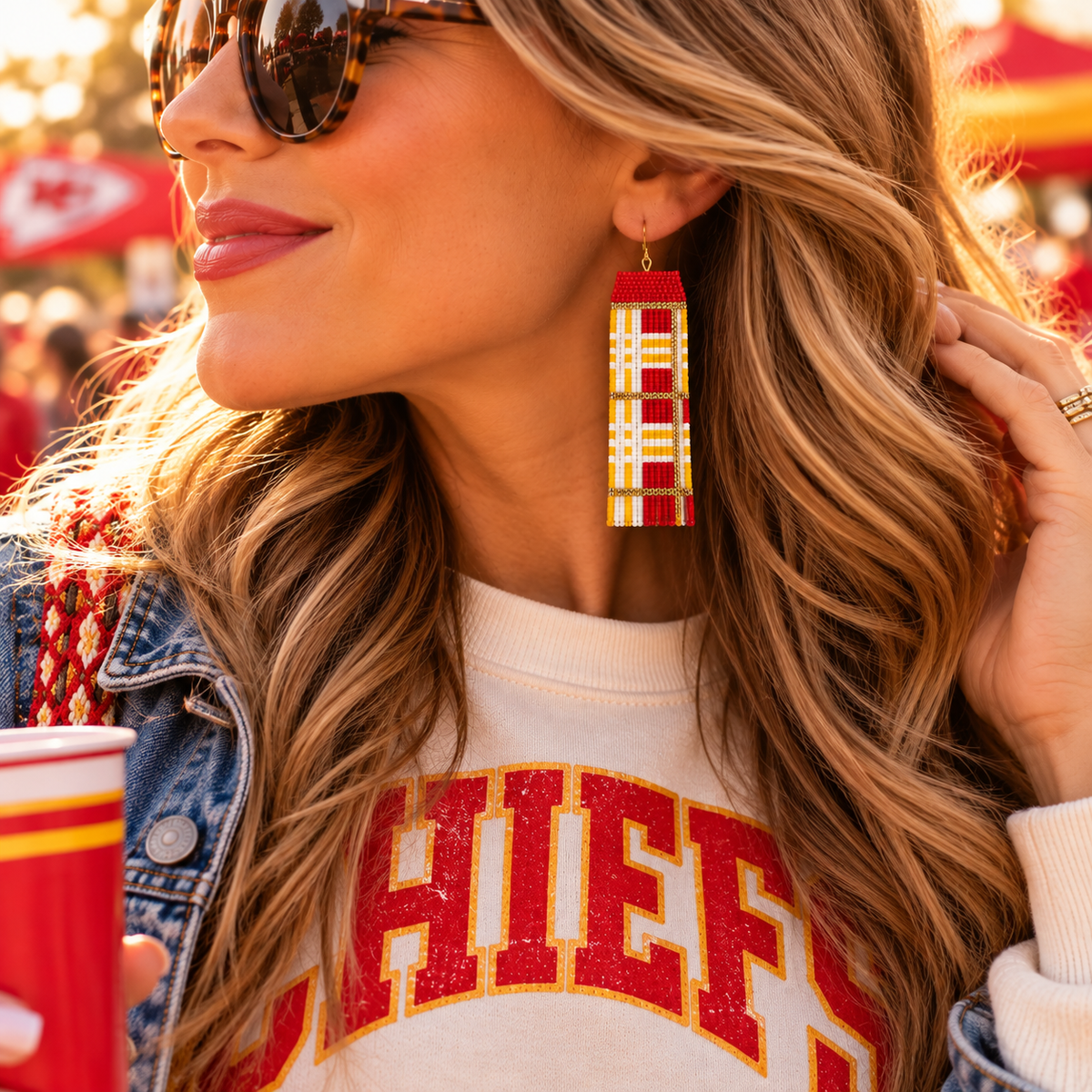 Hand-beaded Kansas City plaid statement earrings worn at game day