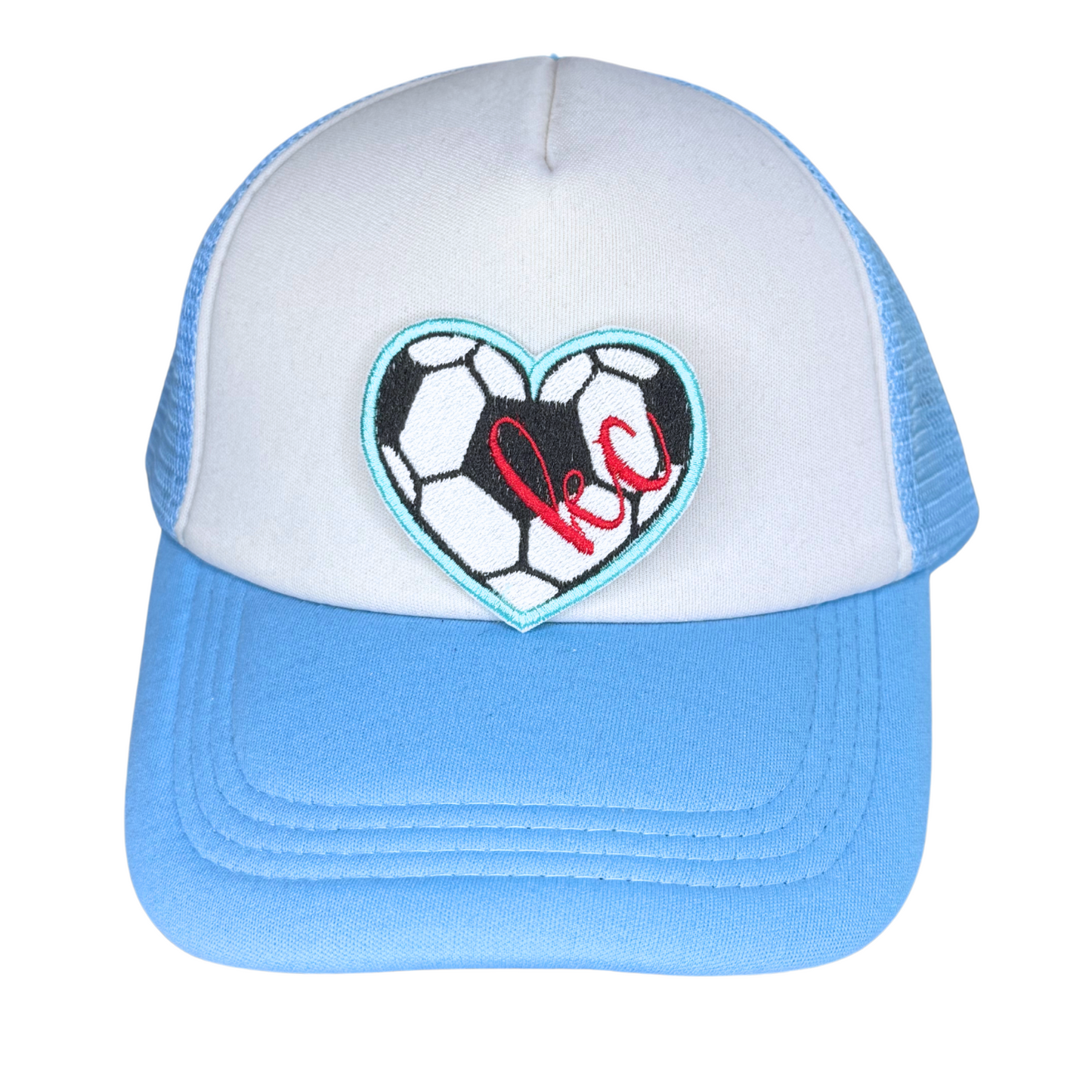 Heart-shaped KC soccer patch shown on blue and white trucker hat