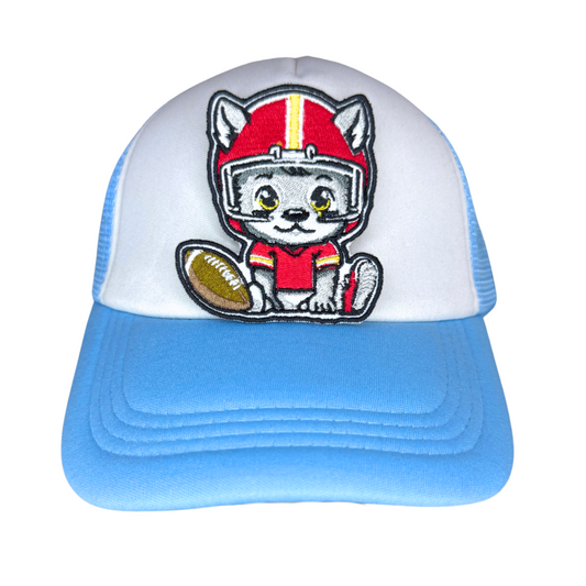Embroidered KC Wolf Baby patch applied to a baby-size white and blue trucker hat