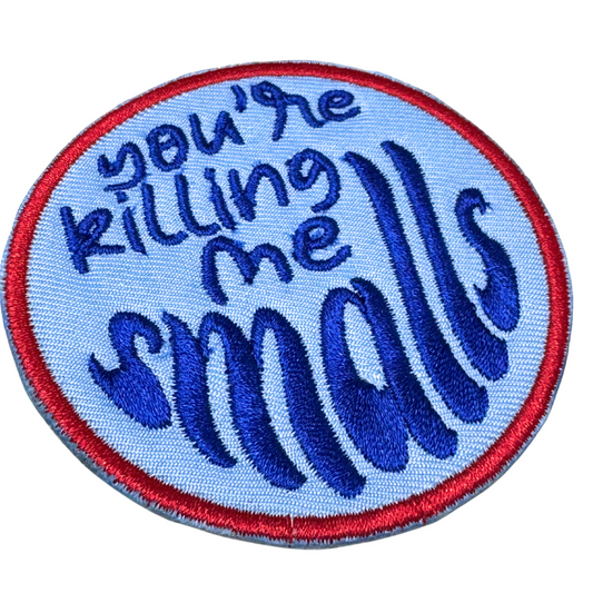 Side angle detail of embroidery stitches on the patch