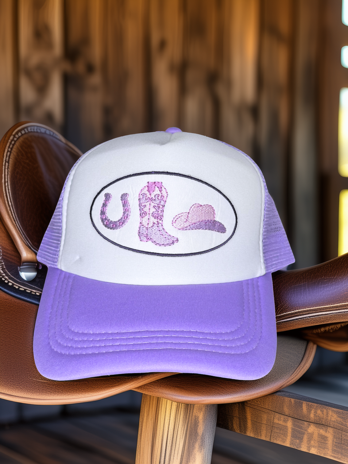 Purple and white cap with a cowboy boot design on a wooden chair