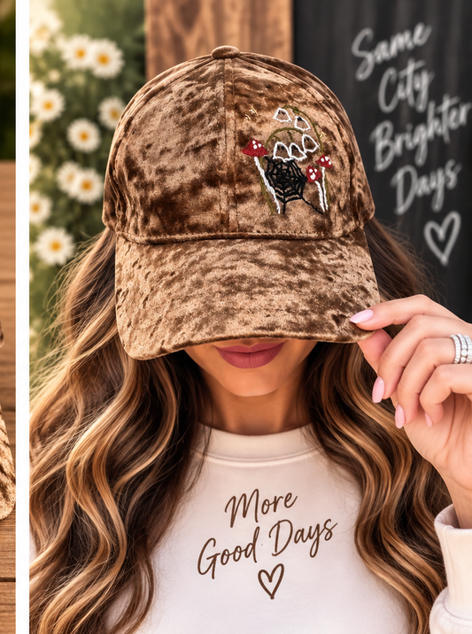 Model wearing brown velvet hand-embroidered mushroom hat