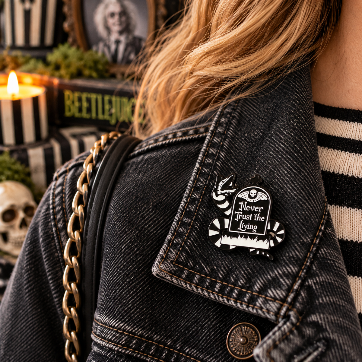 Never Trust the Living striped sandworm enamel pin lifestyle image