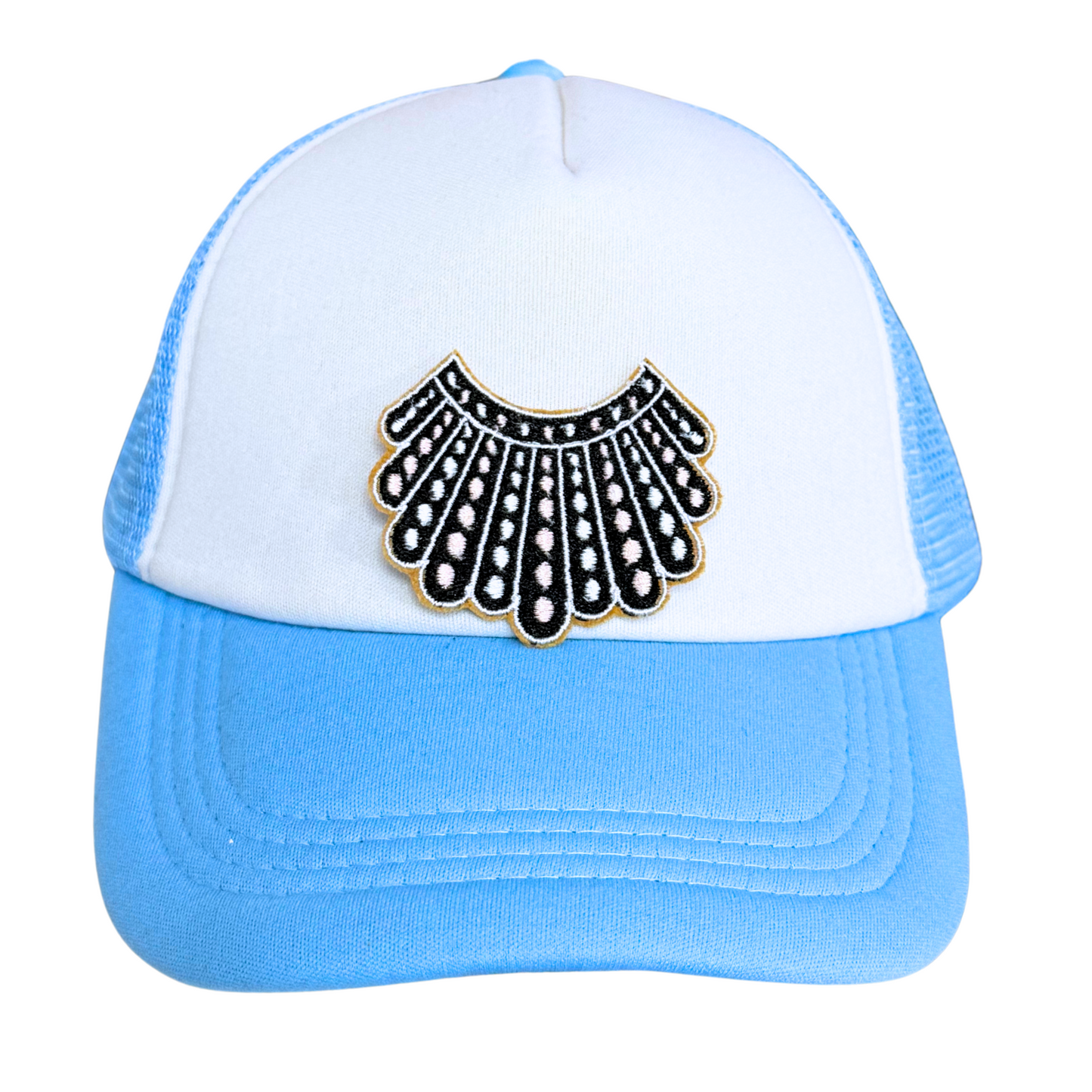 Light blue and white trucker hat with an embroidered dissent collar patch attached.