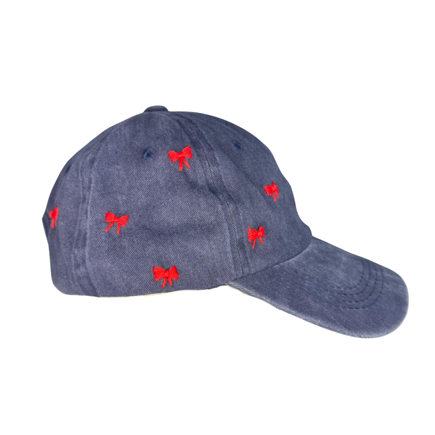 Blue cap with red bow patterns on a white background