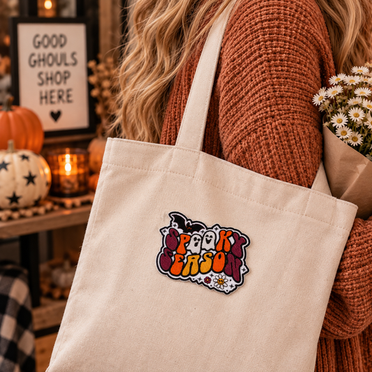 Retro Spooky Season embroidered patch at realistic scale on a cream canvas tote