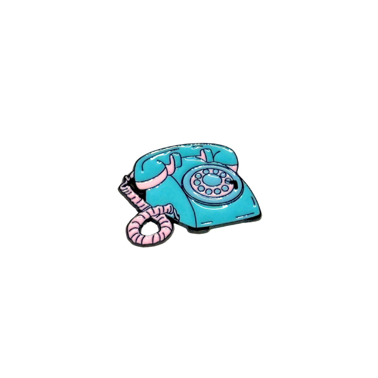 Enamel pin shaped like a teal and pink vintage rotary phone on white background