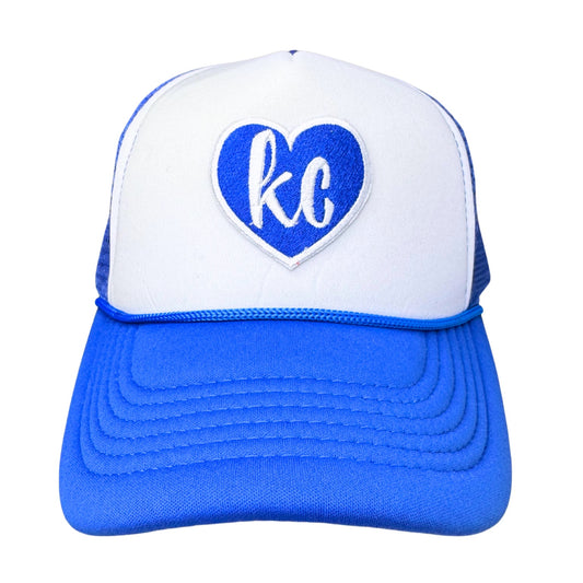 Straight-on product view of royal blue and white KC heart trucker hat