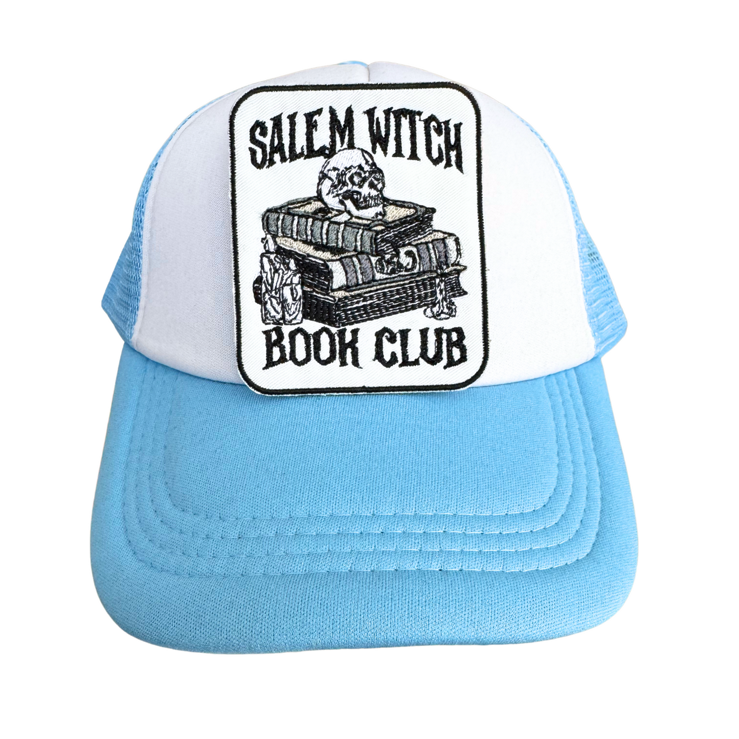 Blue and white trucker hat styled with the "Salem Witch Book Club" embroidered patch, ideal for gothic book lovers.