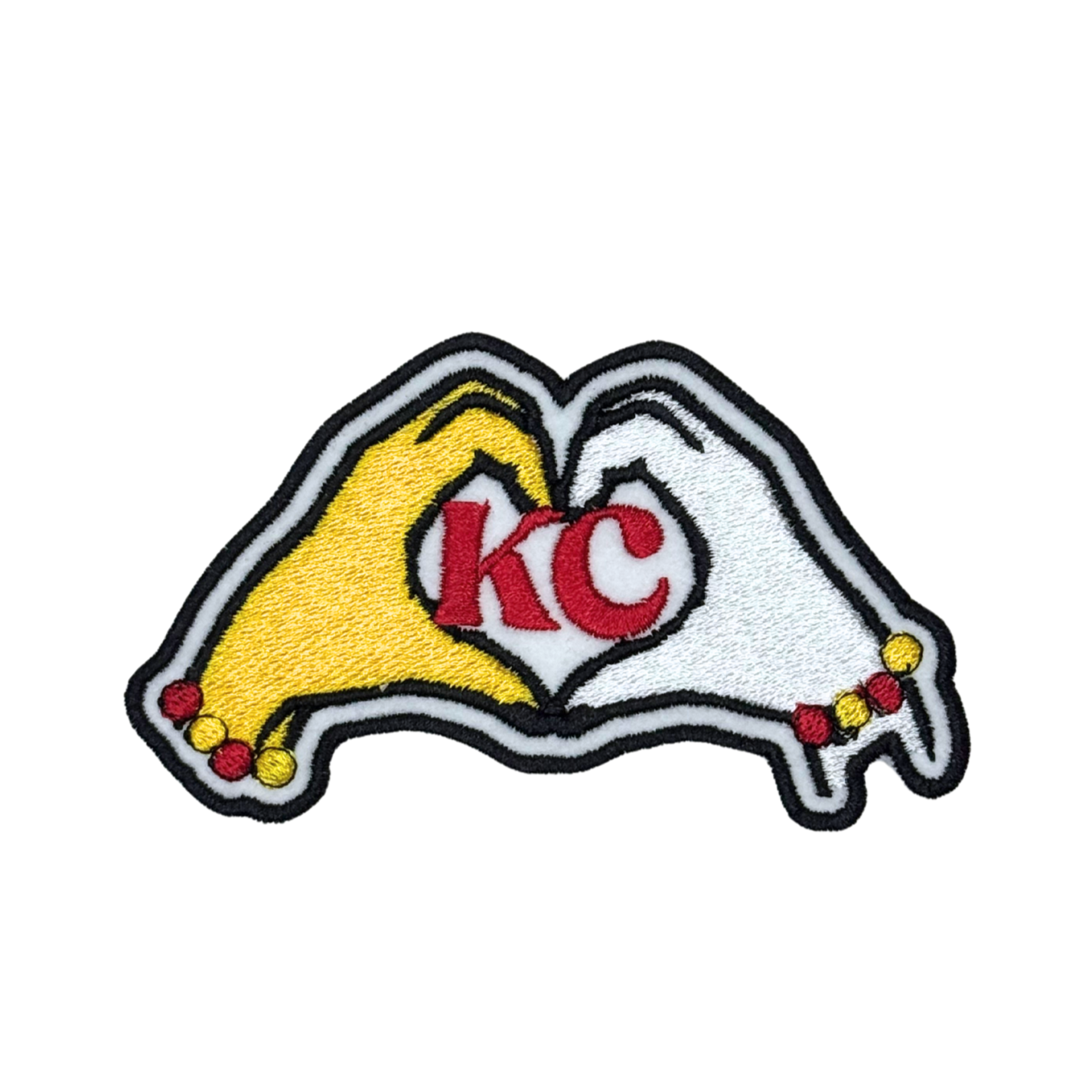 KC patch with red KC letters inside yellow and white hands forming a heart shape