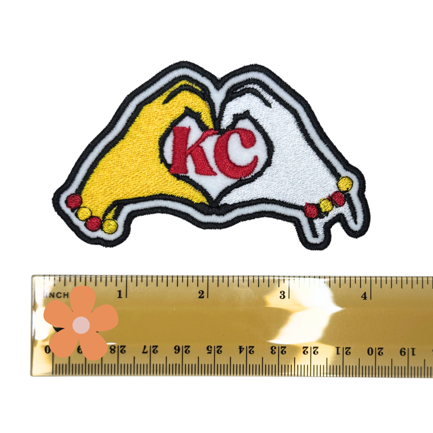KC heart hands patch with ruler for scale