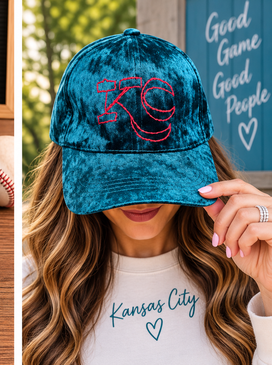Model wearing teal velvet hand-embroidered KC hat