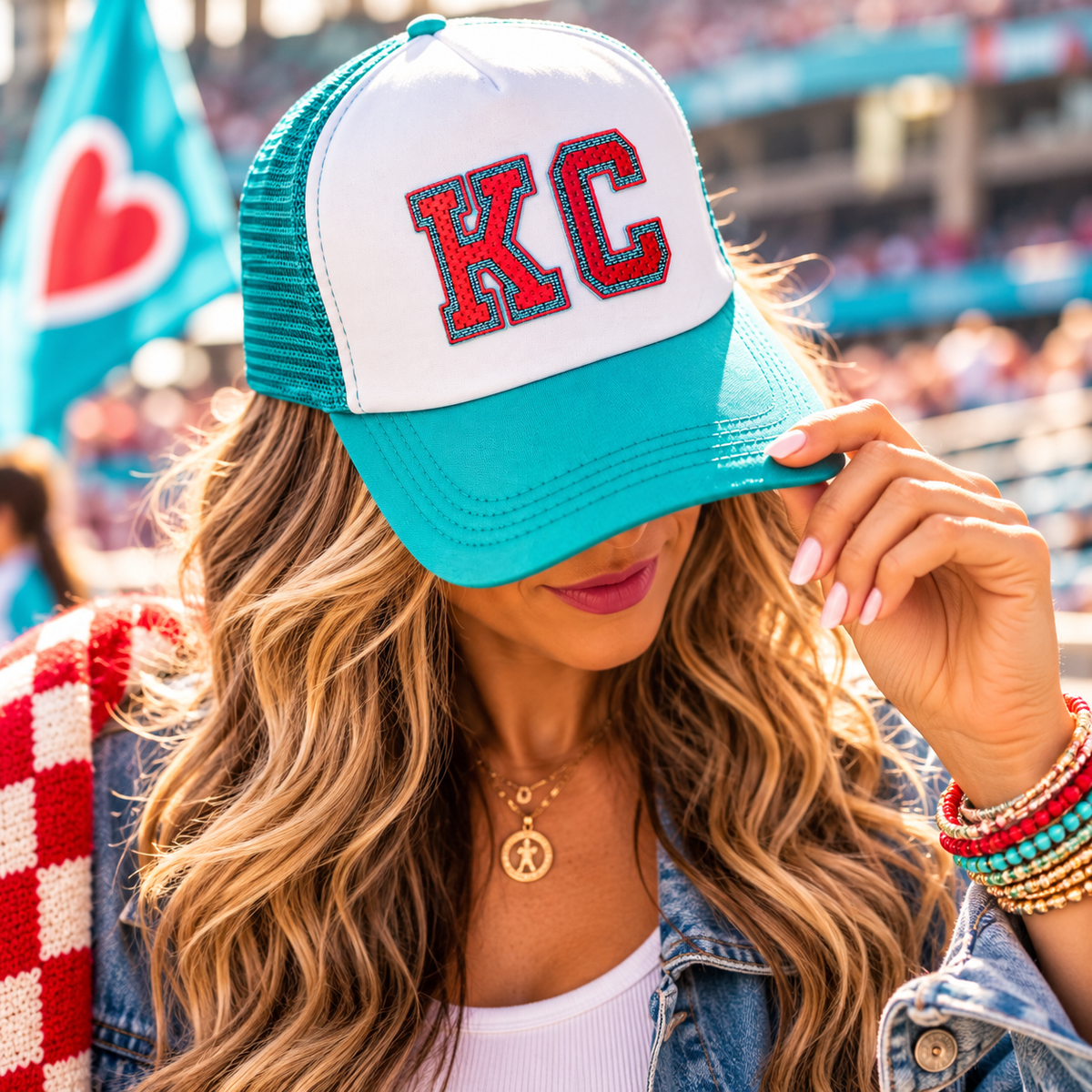 Teal and White KC Current Trucker Hat worn at soccer game