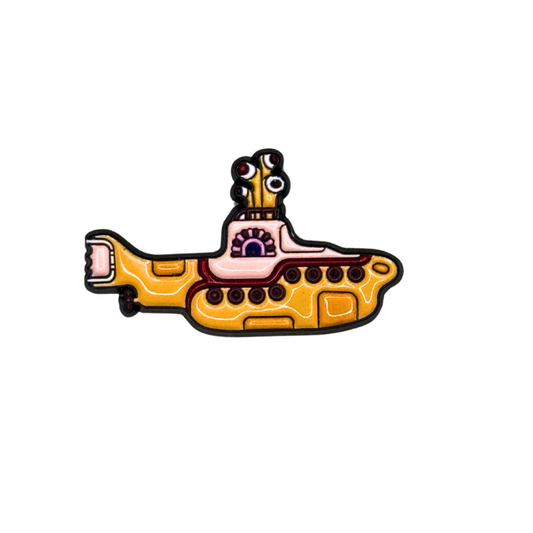 “Yellow submarine enamel pin inspired by 60s Beatles art”