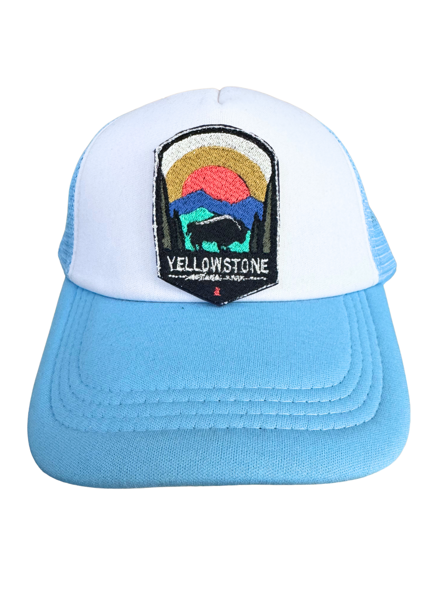 Blue and white trucker hat featuring the Yellowstone National Park embroidered patch, perfect for adventurers and outdoor lovers.
