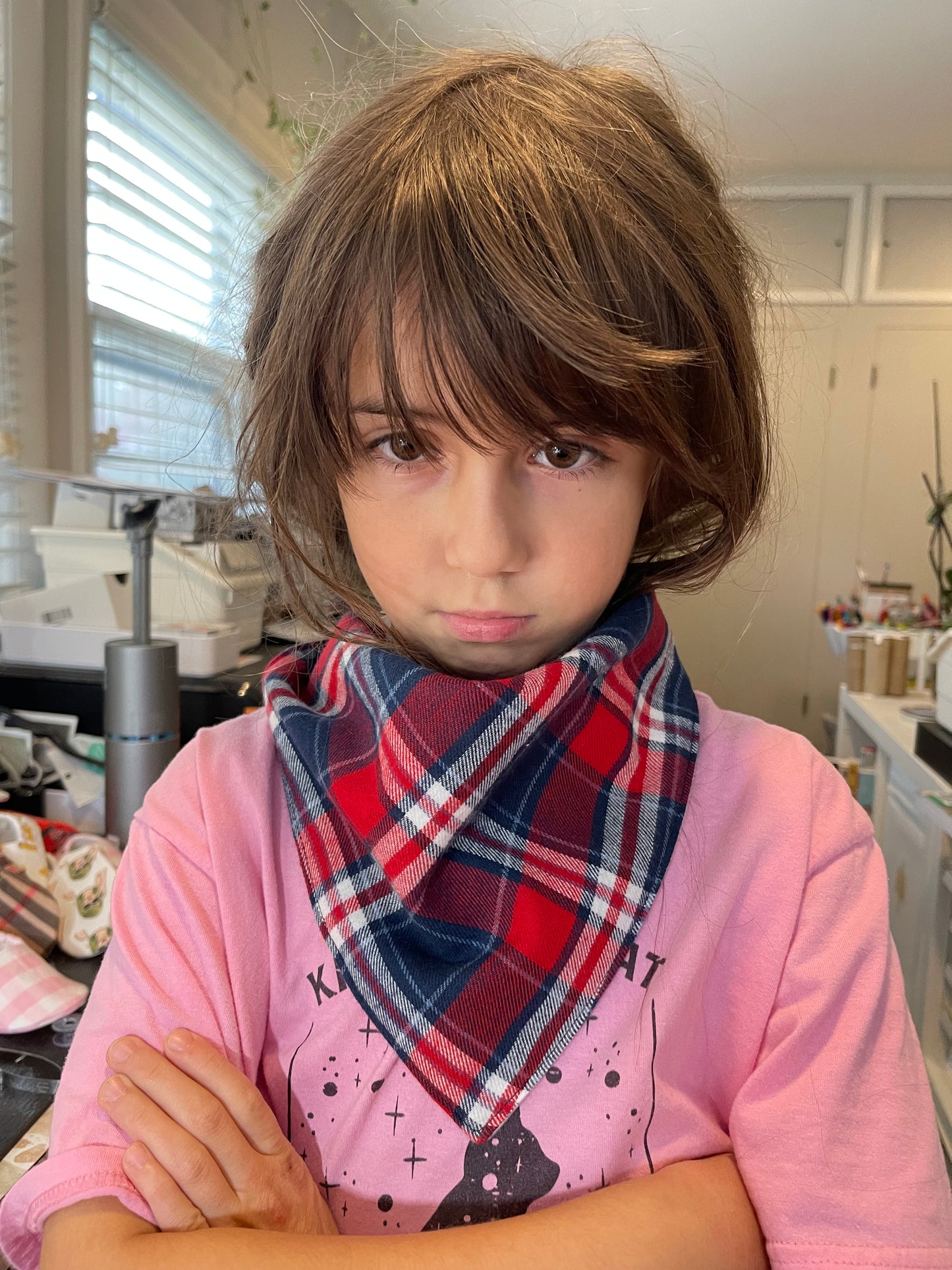 super happy 8 year old modeling bandana scarf to demonstrate sizing perspective