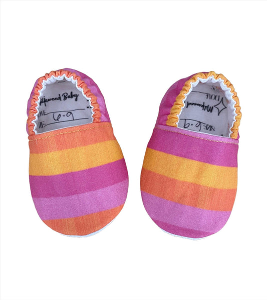 Neon Pink & Orange Stripes Moccasins for baby foot development, handmade with soft fabric.
