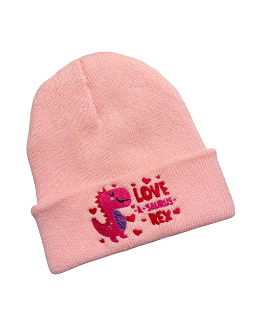 light pink knit beanie embroidered with a pink red and purple dinosaur surrounded by hearts and the text Love-a-saurus Rex