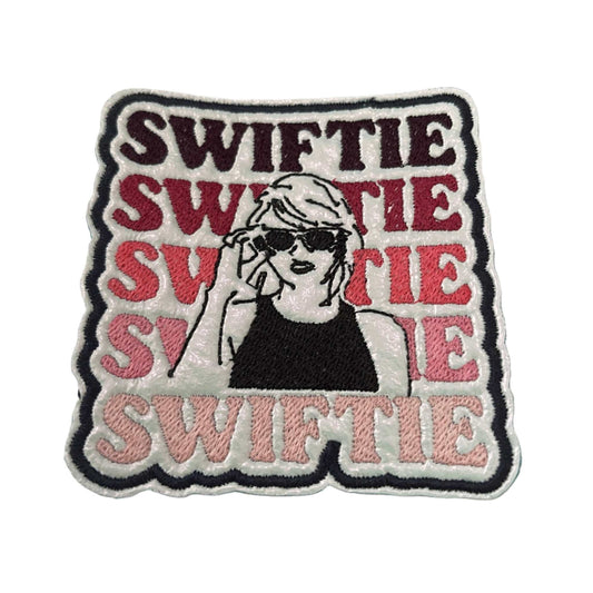 Handmade SWIFTIE iron-on patch with pink gradient and pop star illustration.