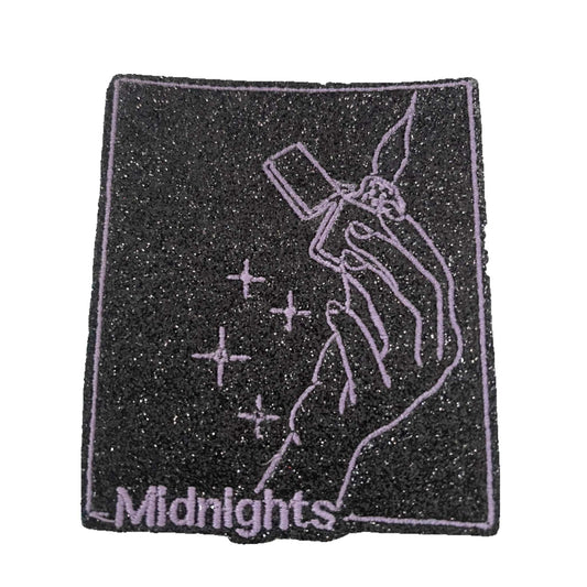 Handmade glow-in-the-dark "Midnights" iron-on patch with hand and lighter design inspired by Taylor Swift album.
