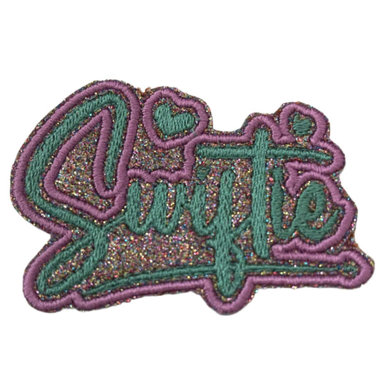 Handmade Glitter "Swiftie" Iron-On Patch with vibrant script and heart accents, perfect for accessories.