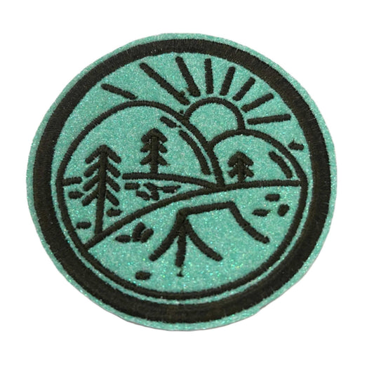 Handmade Nature Scene Iron-On Patch with mint green background and black embroidery.