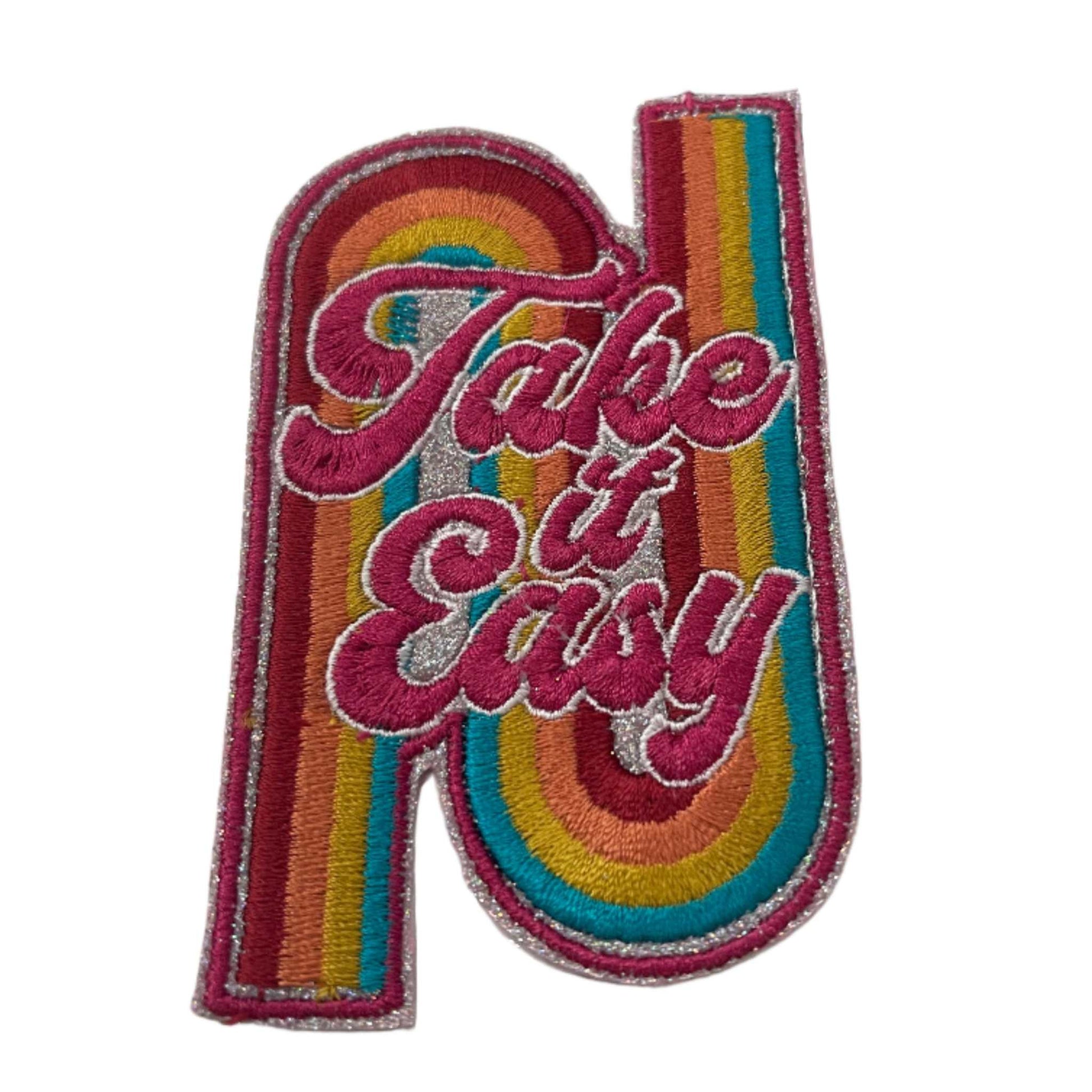 Handmade "Take it Easy" iron-on patch with rainbow glitter and light silver background.