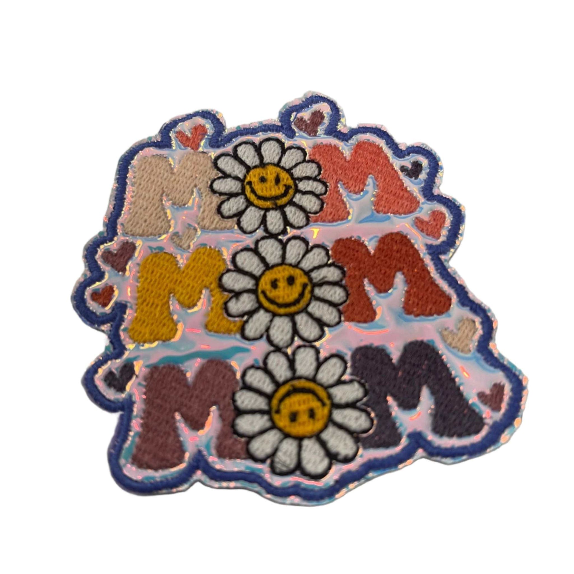 Handmade Mom iron-on patch with multicolor letters, smiling daisies, dark blue outline.