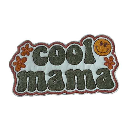 Handmade Cool Mama iron-on patch with aqua text, light blue background, orange flowers, and a yellow smiley face.
