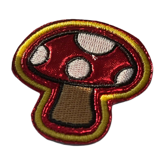 Quirky mushroom embroidered patch for custom trucker hats and accessories.