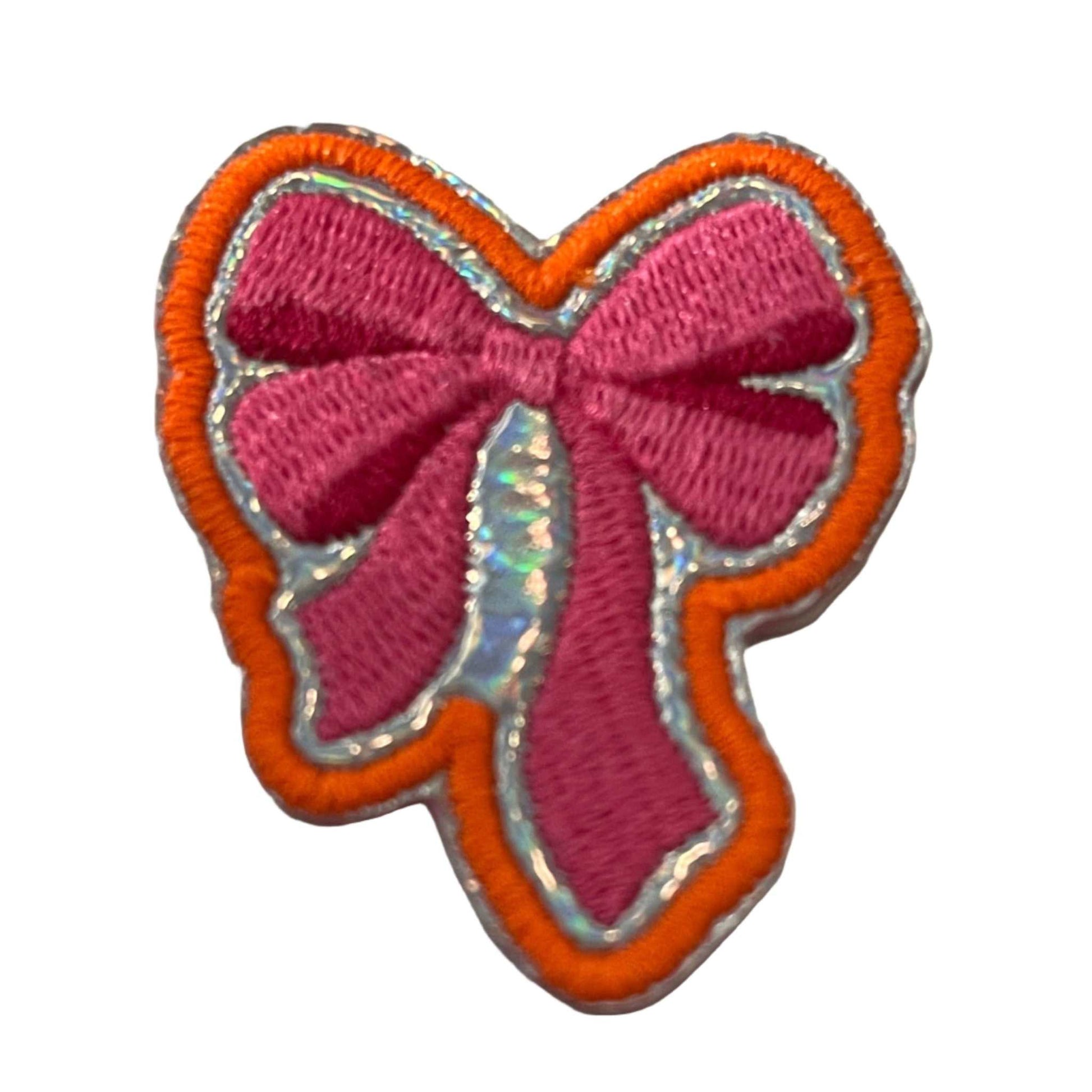 Pink ribbon bow embroidered patch for trucker hats and accessories.