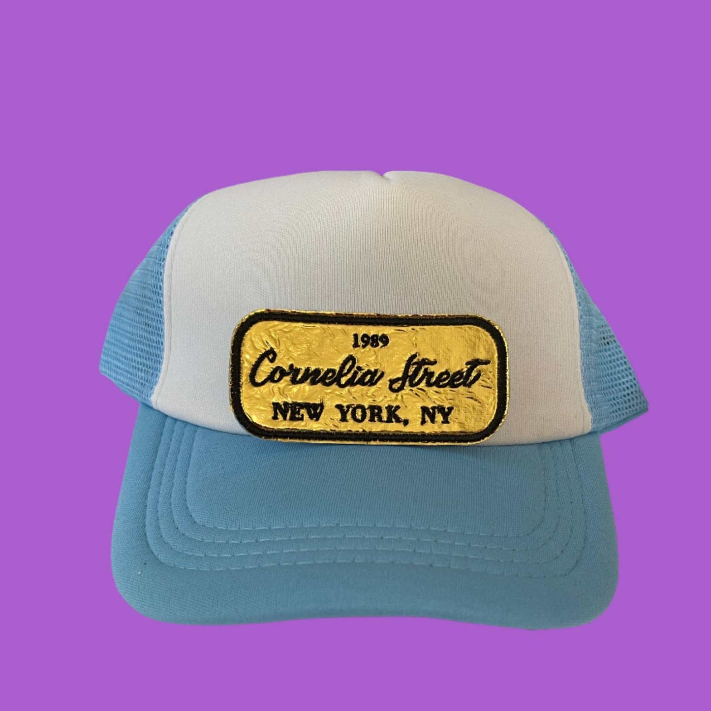 Iron-on patch featuring "Cornelia Street," "1989," and "New York, NY" in a sleek gold and black design, celebrating Taylor Swift's iconic song and NYC residence.