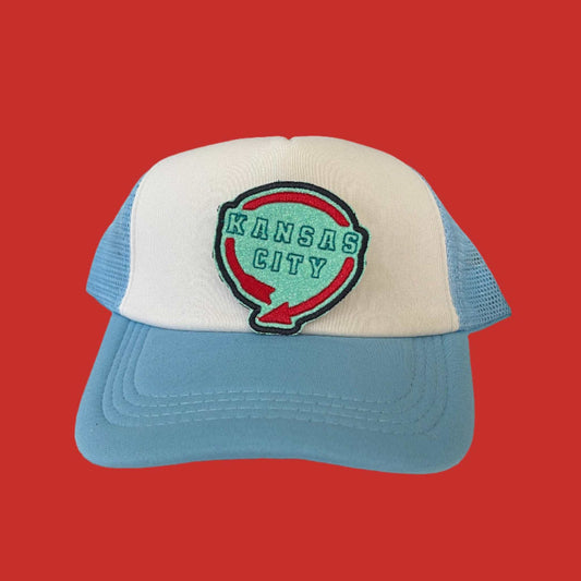 Iron-on patch featuring a design inspired by the Western Auto Building sign in Kansas City, done in KC Current colors, showcasing a stylish and retro aesthetic.