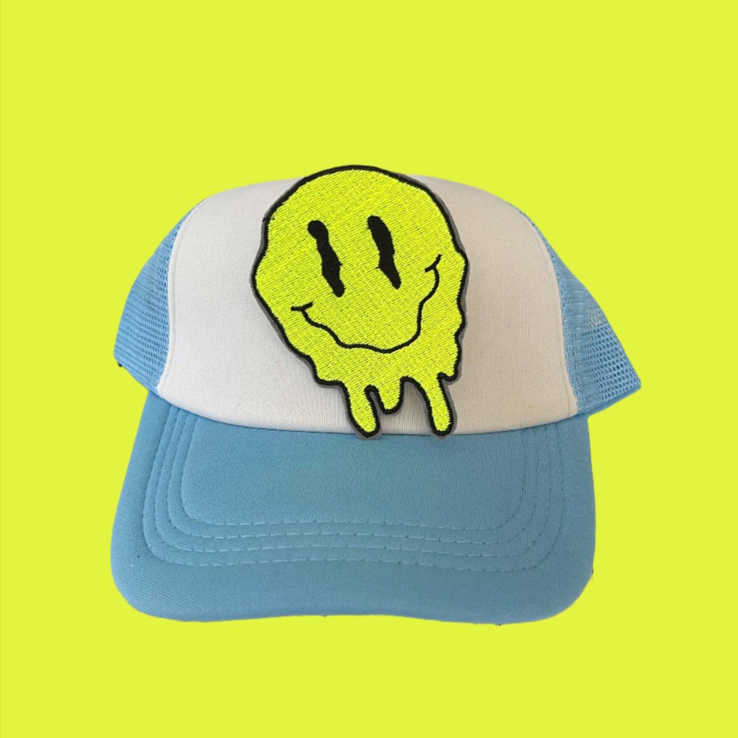 Bright yellow iron-on patch featuring a melting smiley face design, showcasing an edgy and fun retro aesthetic.