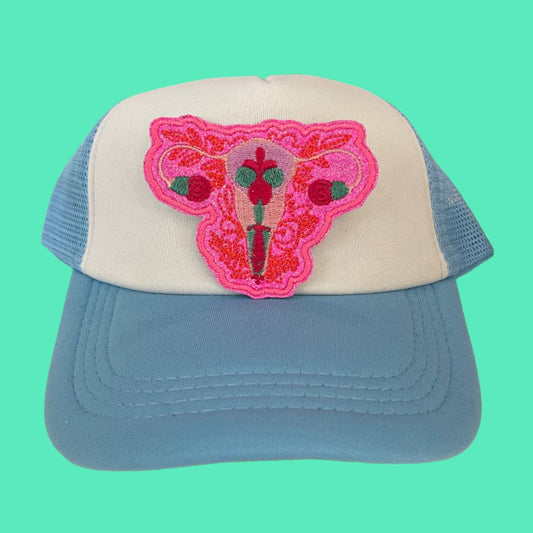 Floral uterus embroidered patch featuring intricate floral designs in vibrant colors, perfect for customizing clothing and accessories.