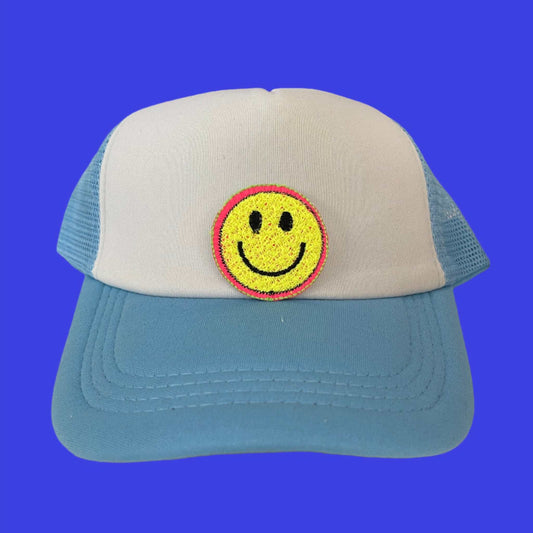 Close-up of a retro smiley face embroidered patch with yellow and pink detailing, perfect for customizing hats and other accessories.