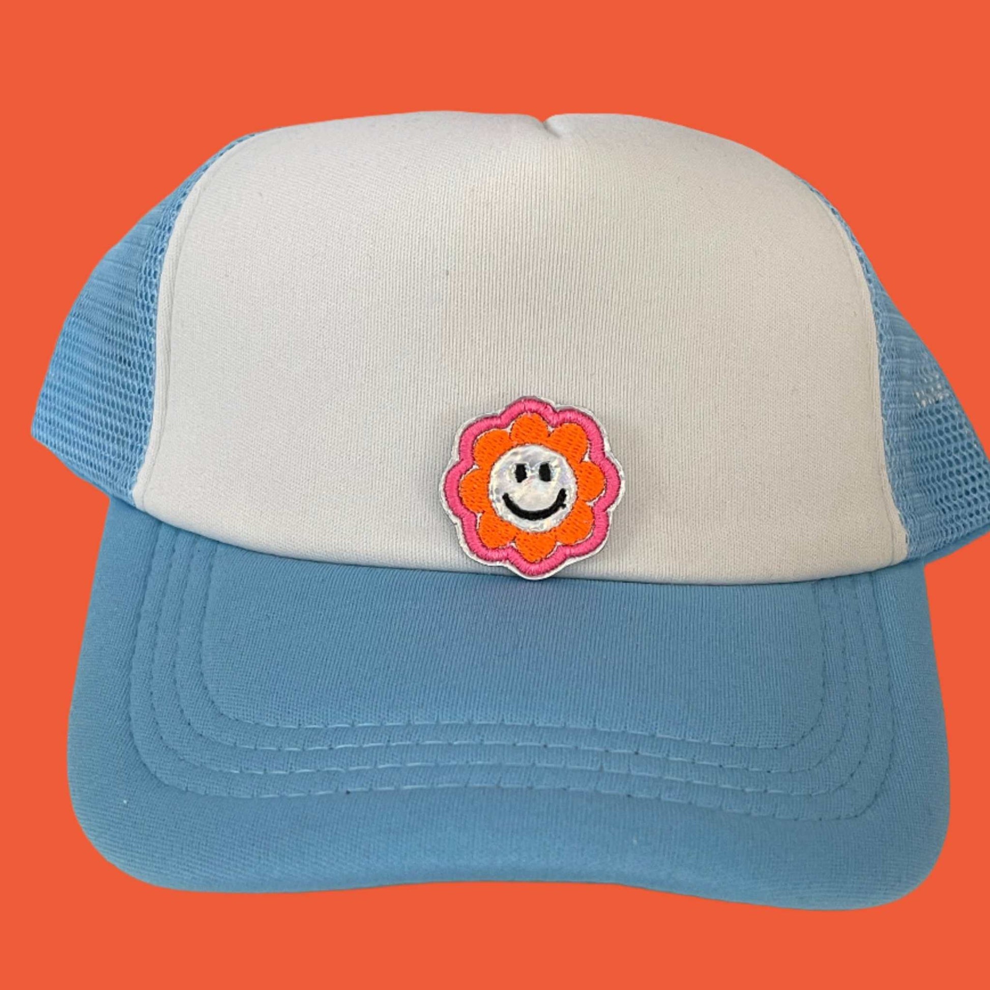 Close-up of a Cheerful Smiley Flower embroidered patch featuring a happy yellow smiley face surrounded by a colorful flower, perfect for customizing hats, apparel, and various accessories.