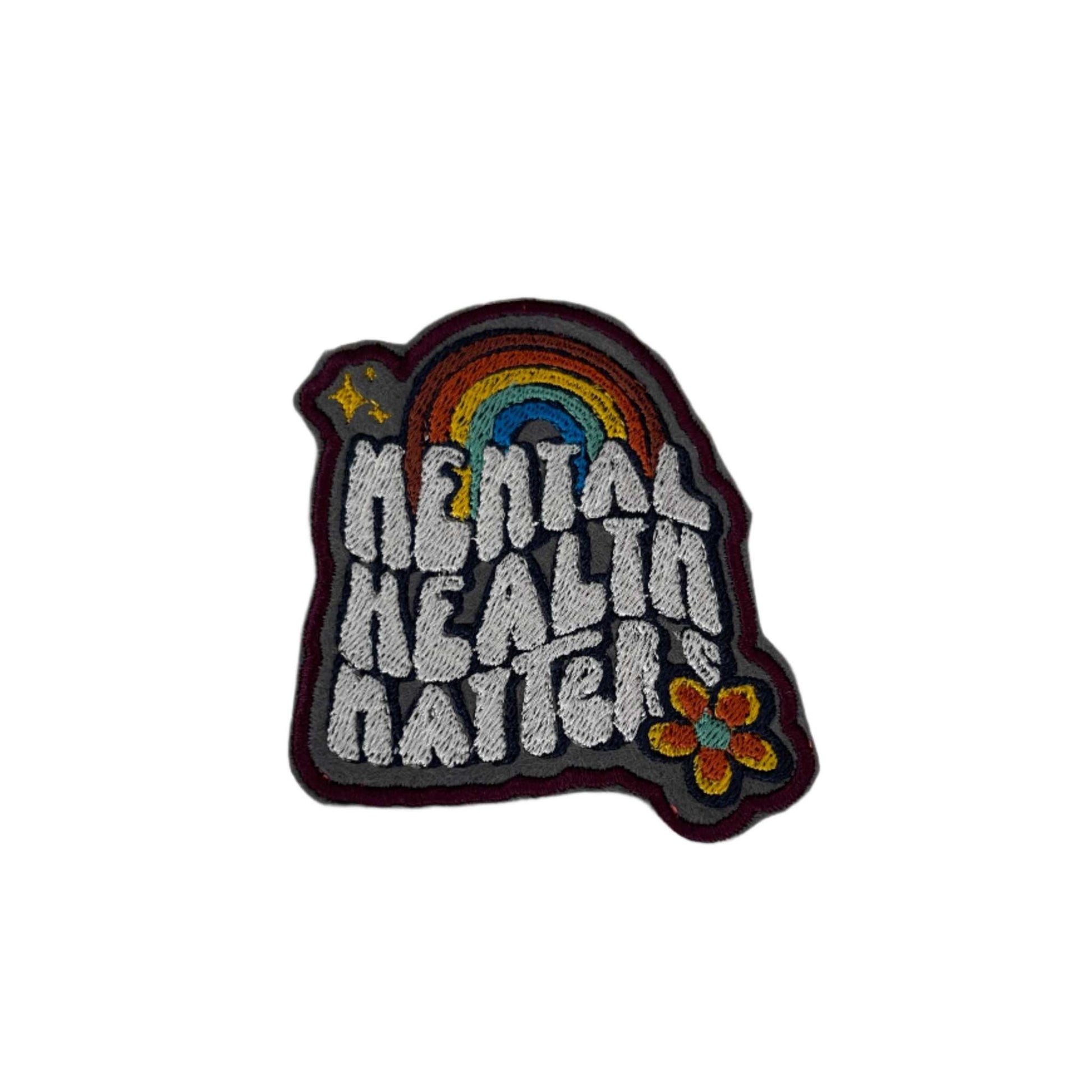 Mental health matters embroidered patch with rainbow design and whimsical style.