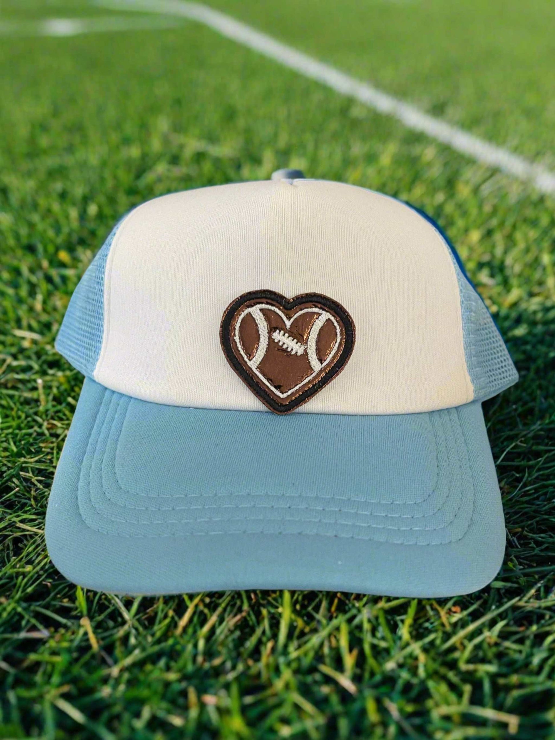 Heart-shaped football patch in brown and white, ideal for adding a sporty and loving touch to your gear.