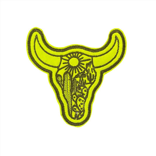 Vivid yellow bull skull embroidered patch with artistic detailing, ideal for hats and accessories.