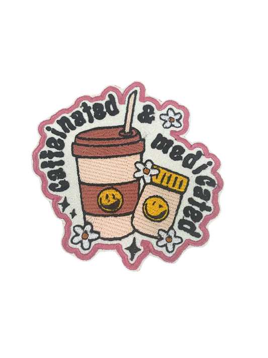 Custom embroidered "Caffeinated & Medicated" patch, featuring coffee cup and pill bottle design.