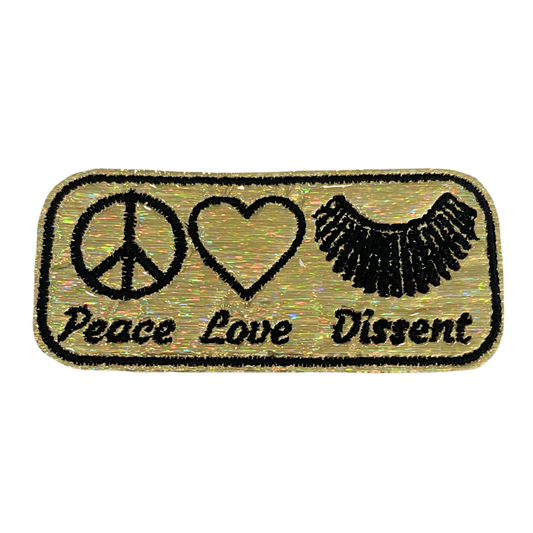 Handmade patch with peace, love, and dissent symbols for customizing accessories.